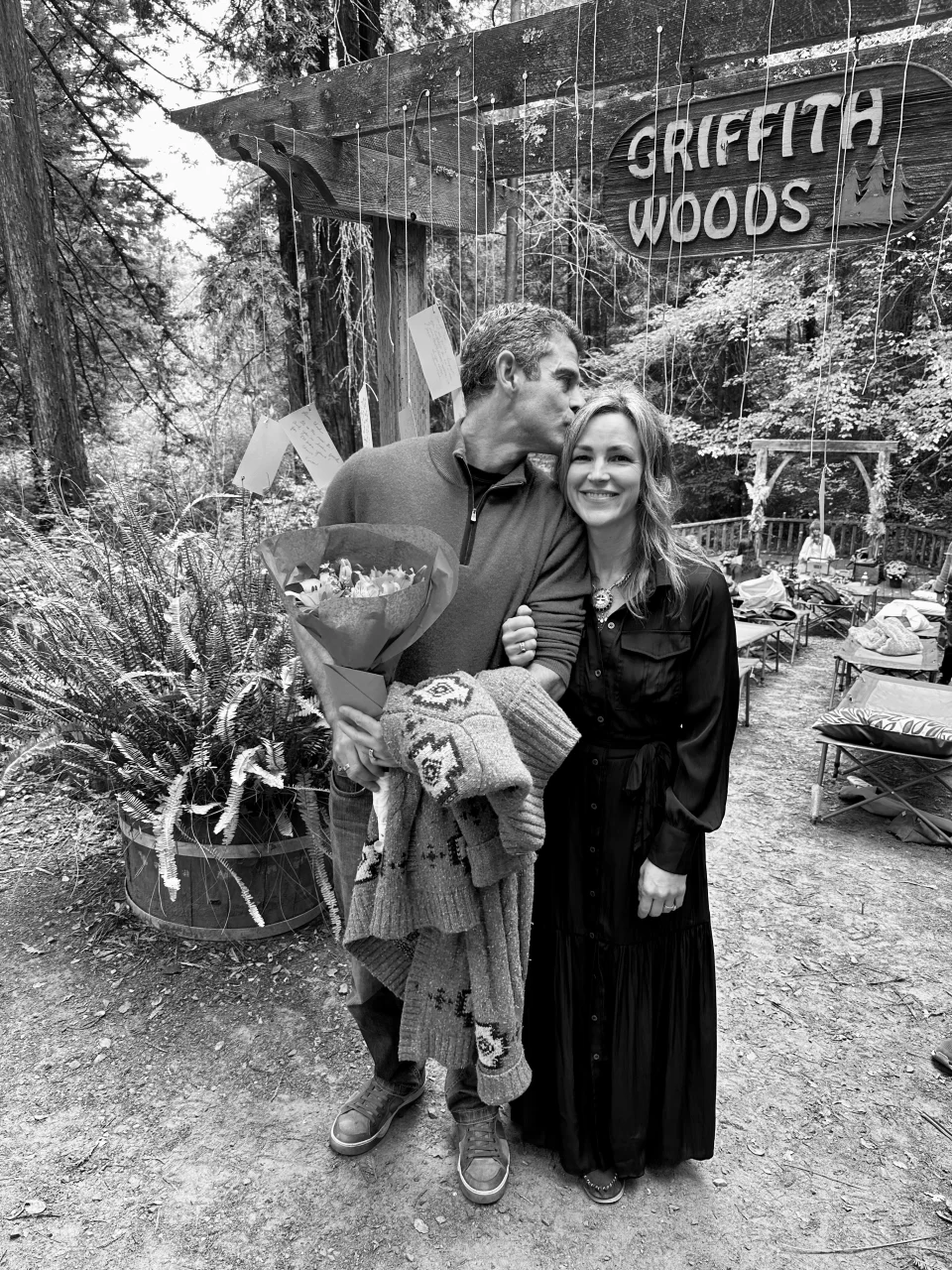 Chad kissing Melissa’s head beneath the Griffith Woods sign.