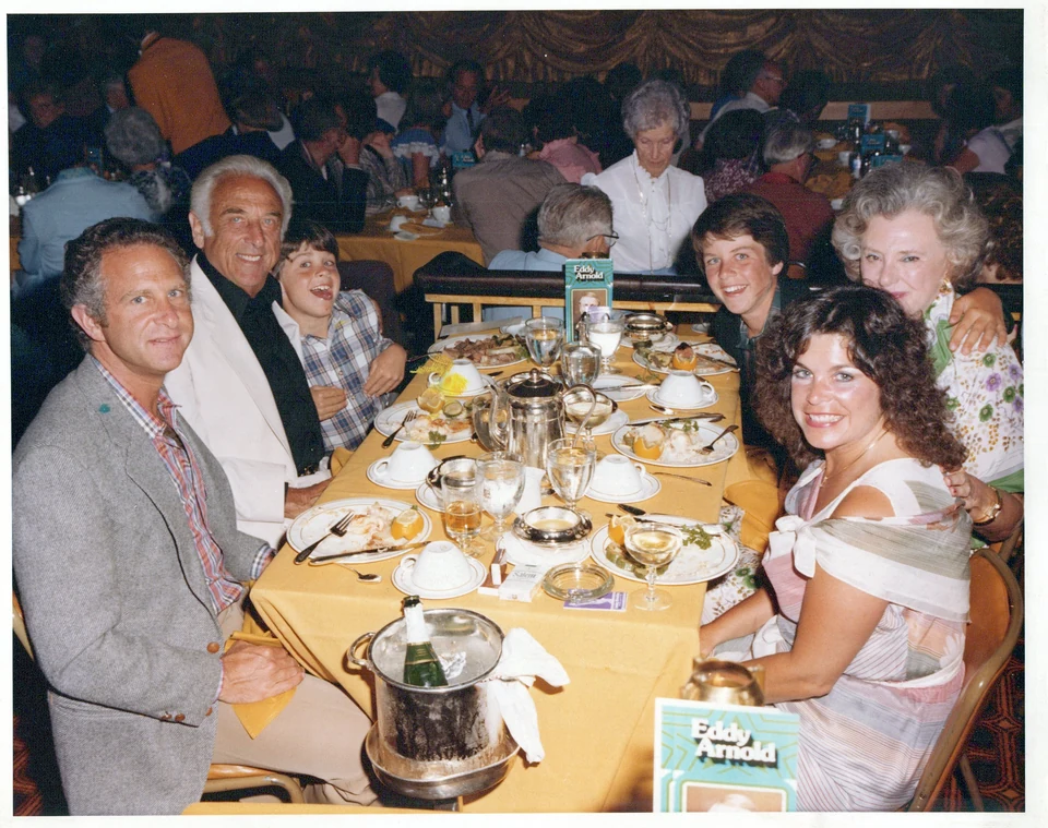 Chad and his family gathered around a restaurant table in Reno.