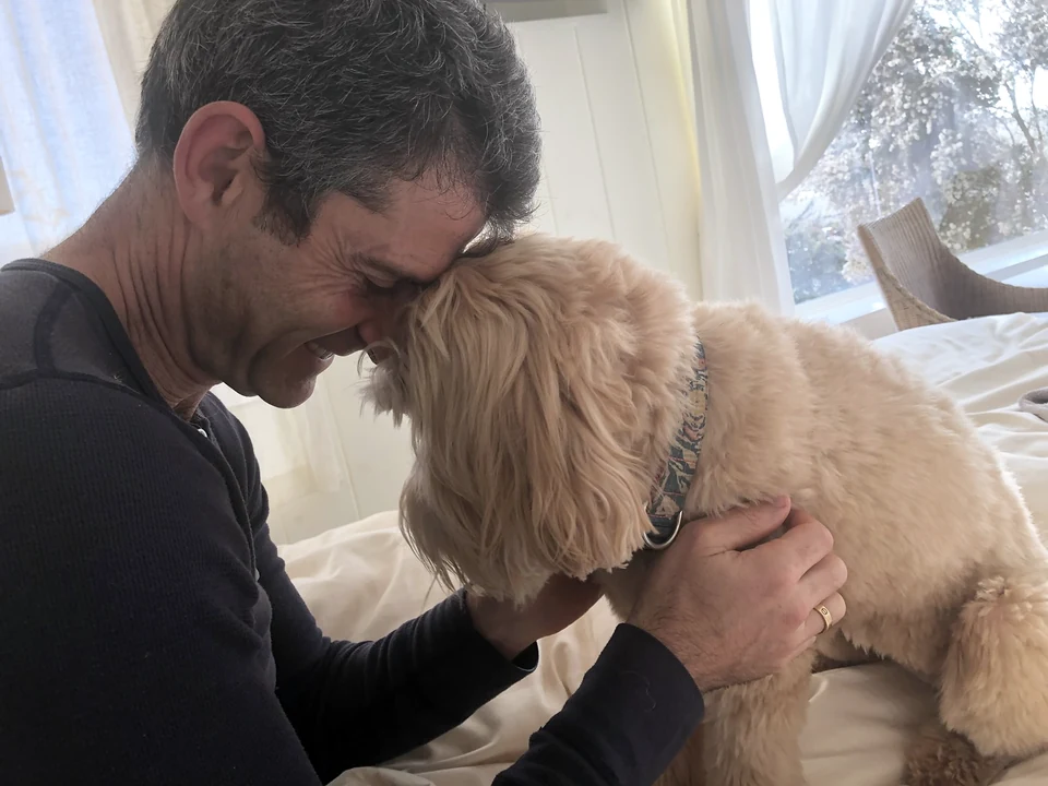Chad touching his forehead to Disco’s head.